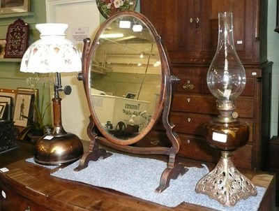 Lot 431 - Anodised copper paraffin lamp with glass shade, toilet mirror and an oil lamp with amber glass...