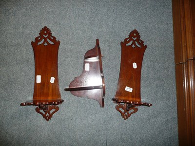 Lot 445 - Pair of mahogany waisted and pierced wall brackets and a corner bracket