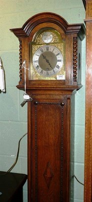 Lot 540 - A small oak longcase clock