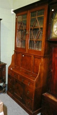 Lot 550 - An early 20th century oak secretaire bookcase