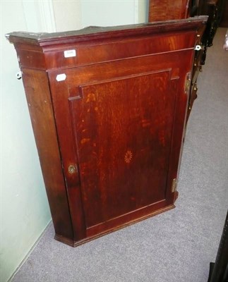 Lot 556 - Georgian oak hanging corner cabinet