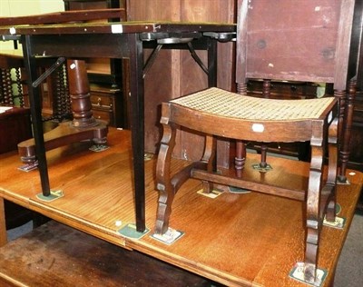 Lot 562 - A card table and a cane stool