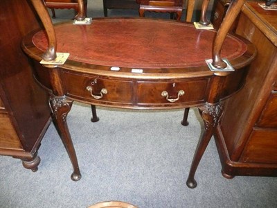 Lot 574 - Mahogany oval table inset with red leather skiver and a late Victorian side table