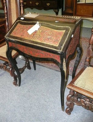 Lot 596 - A Boulle style inlaid bureau (with key)