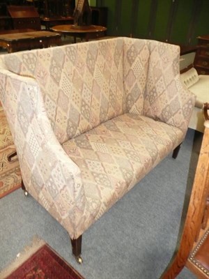 Lot 603 - An early 19th Century wing-back settee