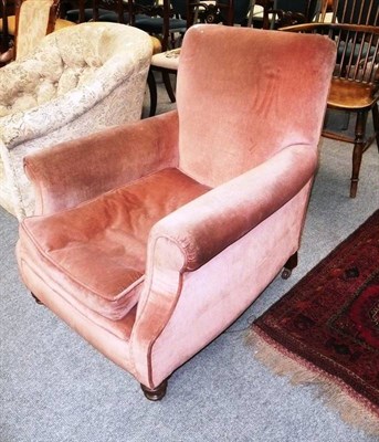 Lot 613 - Upholstered pink armchair