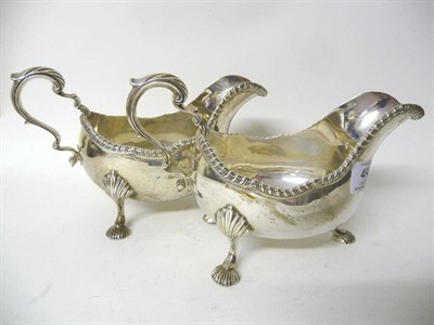 Lot 464 - A Pair of George V Sauceboats, D & J Welby, London 1911 & 1913, three shell feet rising to boat...