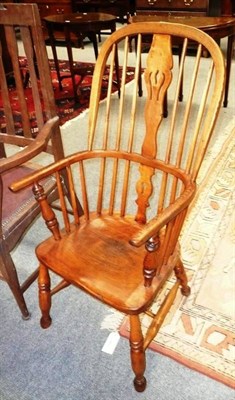 Lot 623 - An ash Windsor arm chair