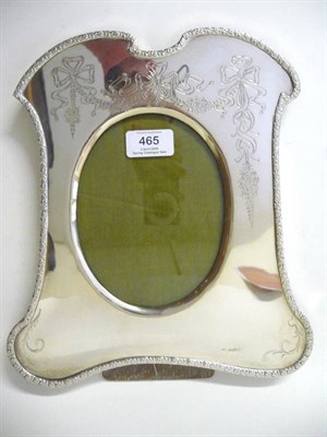 Lot 465 - An Edward VII Silver Mounted Easel Back Photograph Frame, Birmingham 1909, of cartouche shape, with