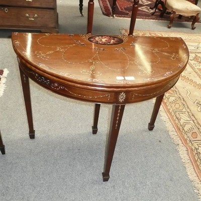 Lot 631 - A reproduction mahogany painted fold over card table