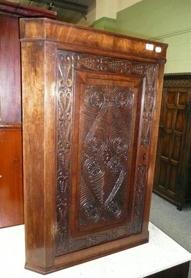 Lot 652 - Carved oak corner cupboard