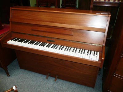 Lot 655 - An upright over strung piano by Kemple