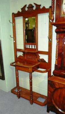 Lot 670 - A late Victorian walnut hall stand