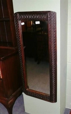 Lot 672 - Carved oak wall mirror