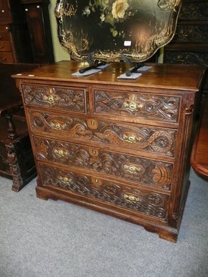 Lot 686 - Carved oak four height chest