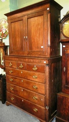 Lot 699 - A George III oak five height chest with associated cabinet top