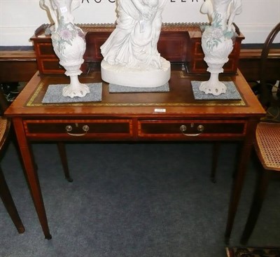 Lot 703 - Edwardian mahogany and satinwood banded writing table with three quarter brass gallery