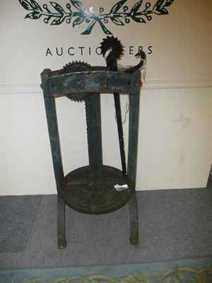 Lot 830 - A cheese press by T C Raddock, Leyburn with handle