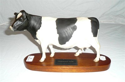 Lot 3 - Beswick matt glazed Friesian cow on plinth