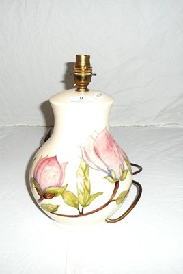 Lot 9 - Moorcroft "Magnolia" lamp on a white ground