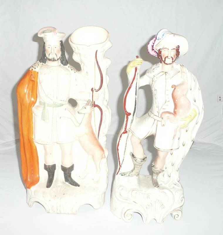 Lot 14 - A Staffordshire pottery figure of a deer hunter, circa 1860, standing holding a bow, a roe deer...