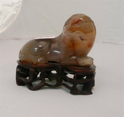 Lot 66 - Carved Chinese onyx figure on stand, Dog of Fo