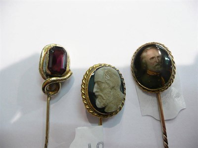 Lot 75 - Gold stick pin with a miniature portrait, another with cameo finial and another set with a...