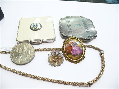 Lot 83 - A compact of white metal, a Strattan compact, a 'Crosse' necklace, a filigree brooch, etc