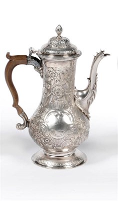 Lot 503 - A George III Coffee Pot, John King, London 1774, of baluster shape, with S scroll fruitwood...