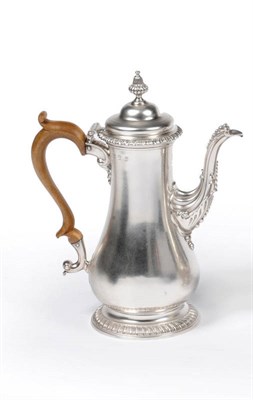 Lot 506 - A George III Coffee Pot, Fuller White, London 1763, of baluster shape, with fluted pedestal...