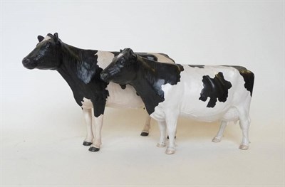 Lot 265 - Two Shebeg Pottery Friesian Cows by John Harper, black and white matt, 16.5 and 15cm high (2)