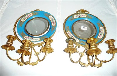 Lot 301 - A pair of French 'Sevres' gilt-metal-mounted porcelain girandoles with mirror backs