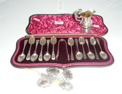 Lot 305 - Set of six silver teaspoons and tongs, another set of six silver teaspoons, a cream jug and...