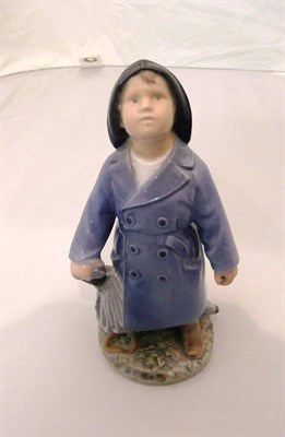 Lot 317 - A Royal Copenhagen figure, boy with umbrella