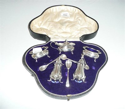 Lot 333 - A silver condiment set in fitted case