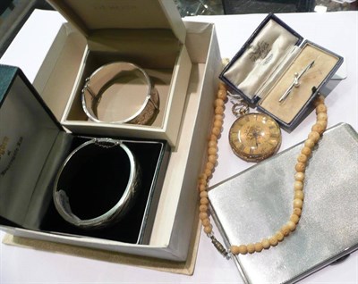 Lot 359 - Two silver bangles, silver cigarette case, pearl bar brooch, gold watch, beads and an...