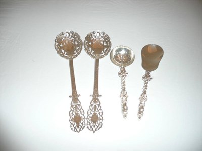 Lot 364 - Two silver filigree serving spoons and two others