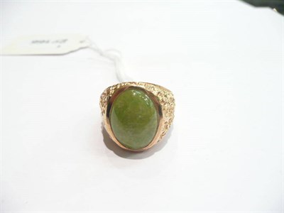 Lot 370 - A 9 carat gold green hardstone ring