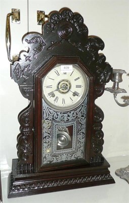 Lot 409 - An American alarm striking mantel clock signed 'Ansonia'