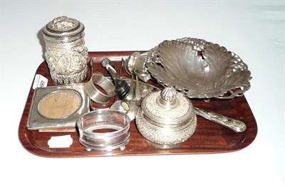 Lot 488 - Quantity of silver pieces including a dish, photograph frame, sugar tongs, napkin ring, spoons, etc