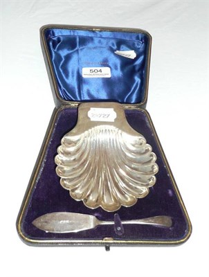 Lot 504 - A cased silver shell butter dish and knife