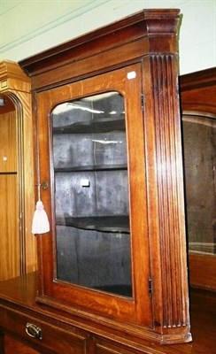 Lot 605 - Glazed Georgian oak corner cupboard