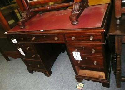 Lot 633 - Mahogany pedestal desk in Georgian-style with inset red leather