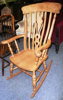 Lot 676 - Pine rocking chair and a Windsor-style chair