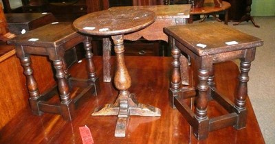 Lot 694 - A pair of oak stools, another oak stool and an oak tripod table