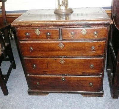 Lot 744 - An 18th century oak straight front chest of two short and three long graduated drawers, on...