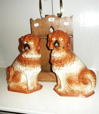 Lot 746 - Pine spoon rack and a pair of Staffordshire dogs