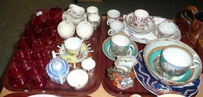 Lot 22 - Twelve cranberry custard cups, tea wares, etc on two trays