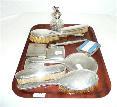 Lot 24 - Three silver cigarette cases, enamel case, atomiser and seven piece silver-backed brush set