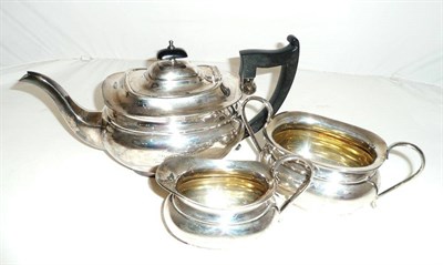 Lot 42 - A silver three piece tea set, approx. 38oz